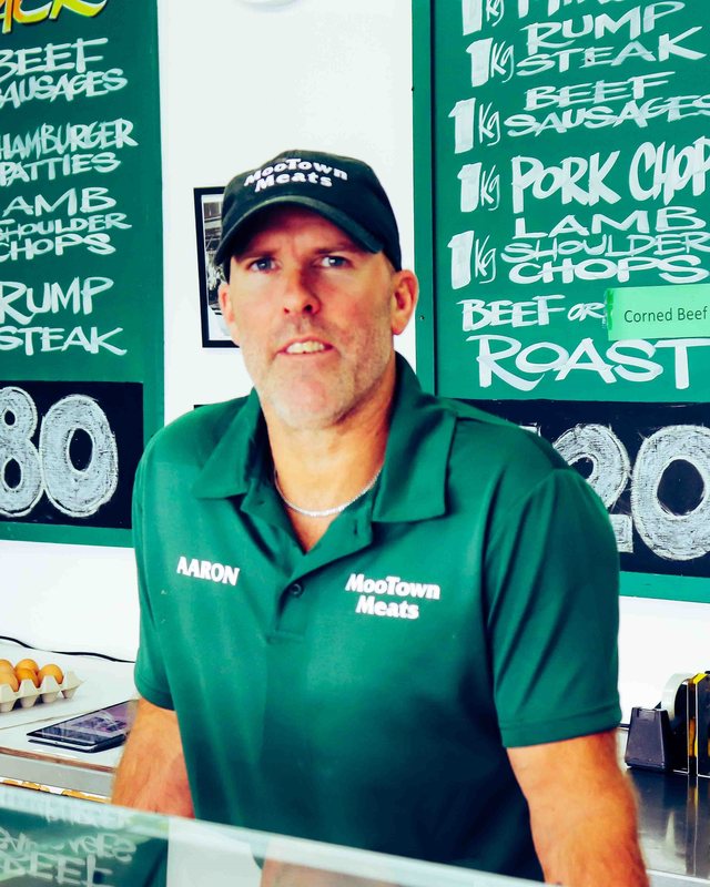 Aaron Atkinson in a MooTown Meats cap and shirt