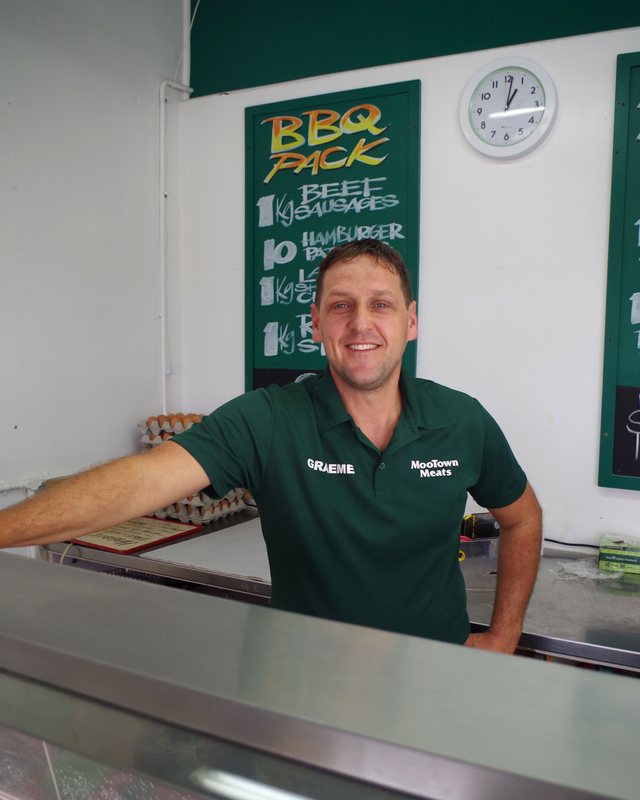 Graeme Hodges behind the counter at MooTown Meats